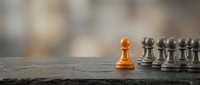 Lone golden pawn standing before silver chess pieces on wooden board, symbolizing leadership, strategy, and competitive advantage in business and decision-making.