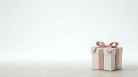 Wrapped gift box with beige and white striped pattern and bow on neutral background, isolated for holiday, celebration, and design projects.