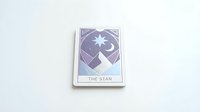 Purple tarot card featuring star and crescent moon symbols on minimalist white background for spiritual and mystical design projects.