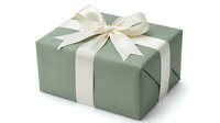 Elegant sage green gift box with cream ribbon bow isolated on white background for holiday celebrations and special occasions.