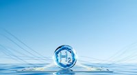 Clear water droplet sphere floating on calm water surface with blue sky background, representing purity, freshness, and environmental sustainability for wellness and eco-friendly design projects.