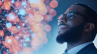 Young African American businessman in glasses and suit smiling confidently against digital network visualization with glowing coral and blue bokeh lights background.