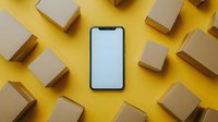 Mobile phone with blank screen surrounded by cardboard delivery boxes on bright yellow background for online shopping and e-commerce concepts.