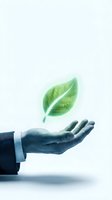 Business professional hand holding glowing green leaf symbolizing sustainability, environmental responsibility, and eco-friendly corporate practices for green business initiatives.