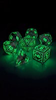 Glowing neon green polyhedral dice set with luminescent numbers on dark background, perfect for tabletop gaming, role-playing games, and fantasy entertainment design projects.
