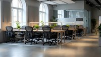 Modern open office workspace with ergonomic chairs and wooden desks in contemporary business environment with large windows and natural lighting.