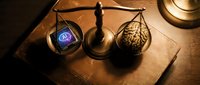 Vintage brass scales weighing human brain against digital eye on wooden surface representing balance between artificial intelligence and human cognition.