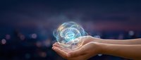 Human hands holding glowing digital brain hologram against blurred city lights background representing artificial intelligence and neural networks.
