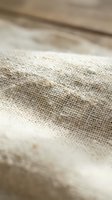 Natural burlap fabric texture with wooden background for rustic design projects and organic material concepts.