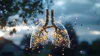 Glowing lungs disintegrating with golden particles against blurred blue sky background, symbolizing respiratory health concept.