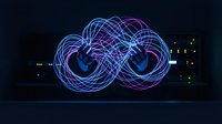 Futuristic digital infinity symbol with glowing neon wireframe design in blue and purple colors on dark background for technology concepts.