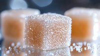 Sparkling sugar cubes with crystalline texture and bokeh background for sweet culinary and beverage photography applications.