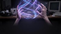 Hands holding glowing neon brain hologram with purple and blue light effects in dark tech workspace for artificial intelligence and innovation concepts.