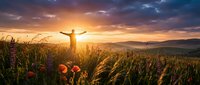 Person with arms raised celebrating freedom in golden wheat field at sunset with dramatic sky and mountain landscape background for wellness concepts.
