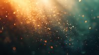 Magical glowing particles floating in dark turquoise and orange atmosphere create dreamy bokeh effect background for fantasy or spiritual designs.