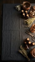 Vintage copper laboratory equipment with dried herbs and glass bottles on dark wooden background for natural medicine and alchemy research.