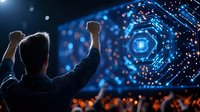 Silhouette of man celebrating success with raised fists against futuristic digital technology display with glowing blue hexagonal pattern and data visualization.