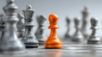 Orange wooden pawn standing out among silver chess pieces on reflective surface, symbolizing uniqueness, strategy, and leadership in business competition.