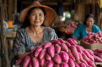 Asian female farmer in straw hat smiling while selling fresh purple sweet potatoes at local market stall, with vendor in background sorting produce.