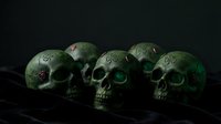 Weathered green skulls with patina texture arranged in a row on dark surface, symbolizing mortality, decay, and gothic themes for horror, Halloween, and artistic projects.