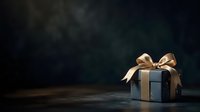 Luxury gift box with gold ribbon bow on dark textured surface, suitable for holiday marketing, greeting cards, and festive promotional materials.