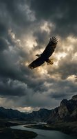 Majestic eagle soaring through dramatic storm clouds above mountain landscape with winding river valley below creating powerful nature scene.