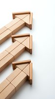 Wooden building blocks arranged in bridge construction pattern on white background isolated for educational toys and creative play concepts.