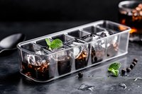 Cold brew coffee in transparent glasses with ice cubes and fresh mint leaves on dark background, modern beverage presentation for cafe menu and food photography.