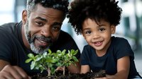 African American father and young child planting seedlings together, exploring nature and gardening while bonding. Close up portrait showing joy and learning experience.