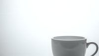Gray ceramic coffee mug on white background isolated for product photography and commercial design projects.