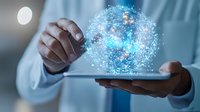 Digital transformation concept shown through glowing blue holographic sphere floating above tablet device held by business professional in white shirt.