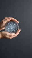 Hands protecting glowing network sphere with connected nodes representing digital transformation, cybersecurity, and global connectivity concepts.