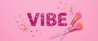 Glittery vibe text with makeup brushes and sparkles on pink background, suitable for beauty, cosmetics, and lifestyle design projects.