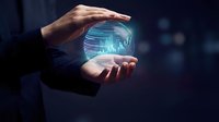 Businessman holding glowing digital globe with financial data charts and stock market graphs, representing global business analytics and investment technology solutions.