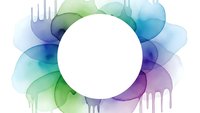 Abstract colorful watercolor splash with white circle frame for text, flowing paint drips in blue green purple tones for creative design projects.