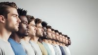 Diverse group of men standing in profile line showing unity and teamwork concept for business leadership and collaboration projects.