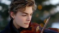 Young male musician with blonde hair playing violin with closed eyes, expressing deep emotional connection to classical music during outdoor performance.