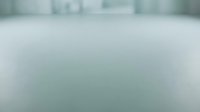 Blurred urban cityscape with soft focus buildings and overcast sky, suitable for backgrounds, web design, and corporate presentations.