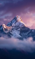 Majestic snow-capped mountain peak rising above clouds at sunset with dramatic purple sky, perfect for adventure travel promotions and nature publications.