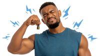 African American man with pained expression holding ear, surrounded by blue lightning bolts representing tinnitus, hearing loss, or ear pain.