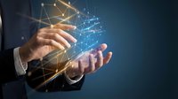 Businessman holding glowing digital network with connected nodes, representing blockchain, AI, and data technology innovation in modern business.