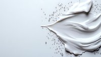 White cream texture with water droplets on light background for skincare and cosmetic product advertising campaigns.