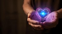 Hands cupping glowing neon heart with blue and purple light effects against dark background for healthcare, love, charity and wellness concepts.