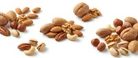 Assorted mixed nuts including almonds, walnuts, hazelnuts, pecans and pistachios scattered on white background for healthy snacking and cooking ingredients.