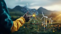 Hand in yellow jacket pointing at glowing holographic renewable energy data visualization with wind turbines against mountain landscape at sunset.