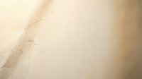 Soft beige abstract background with gentle gradient and subtle texture for elegant design projects and presentations.