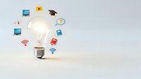 Light bulb with floating digital icons representing innovation, technology, creativity and online education concepts for business presentations.