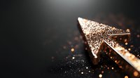 Glowing golden arrow points upward against dark background with sparkling particles and bokeh lights creating dramatic business success concept.