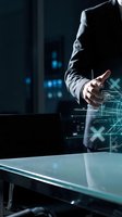 Professional businessman in suit touching holographic digital interface with glowing data visualization elements in modern office environment.