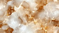 Luxurious white and gold marble texture with natural veining pattern creates elegant surface design for interior decor and luxury branding backgrounds.
